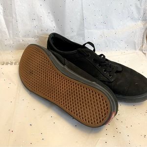 Black vans, lace up, tan bottom
